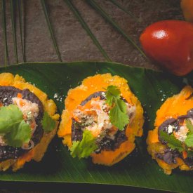 Indulge in the flavors of Costa Rica in dishes like Patacones Del Tigre.