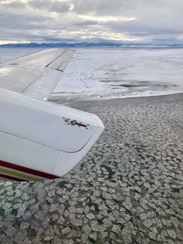 Plane flying over the Artic coast on the Polar Bear Adventure Tour
