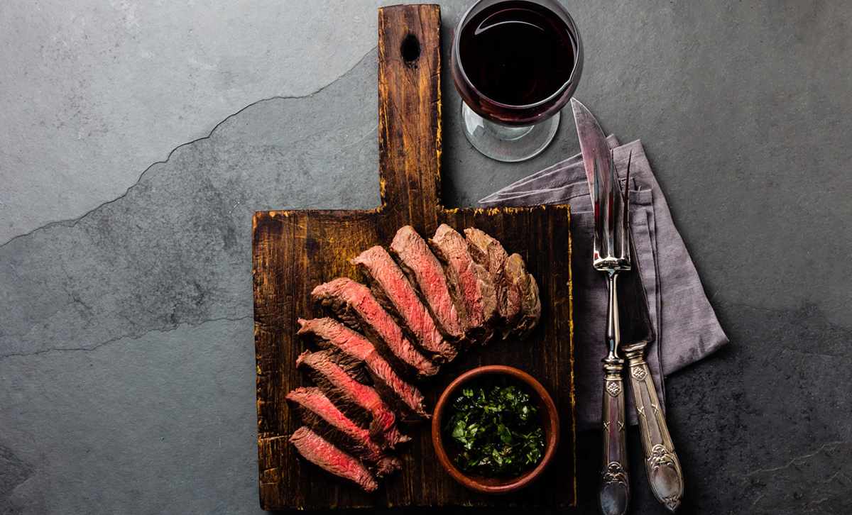 Slices of medium-rare steak, cooked Argentinian Asado style