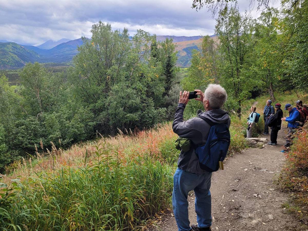 Guests Group Hiking In Alaska