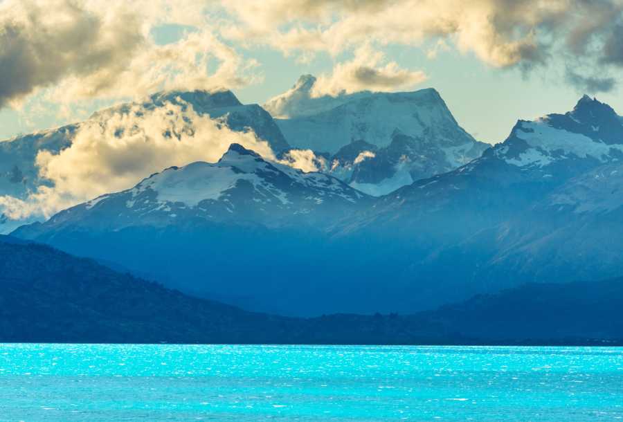 brilliant blue lake by mountains in Pategoinia