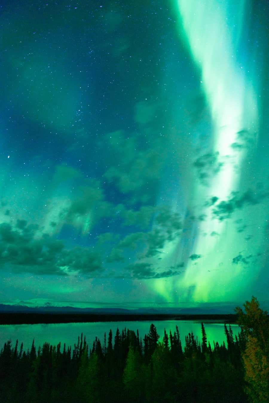 northern lights over lake in Alaska