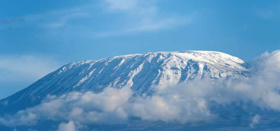 Top of mount kilimanjaro over clouds