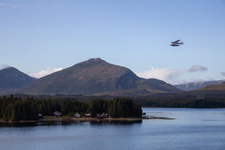 plane flying over lake in Alaska