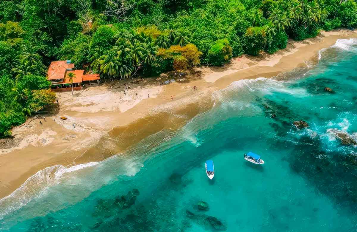 Where to Travel in 2026: Explore These Spectacular Destinations 2 A drone photo software a beach in Costa Rica, one of NYT's picks for where to travel in 2026. The sea is pure blue and