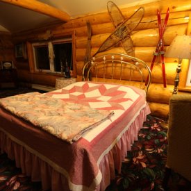 Rest and relax in cozy rooms at A Taste of Alaska Lodge.