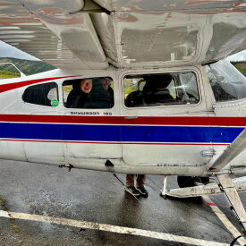 Board a plane for a flightseeing experience with views of the Alaska Range.
