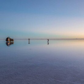 Drive through a perfect mirror where the sky and salt blend into one surreal expanse during our journey across the Uyuni Salt Flats.