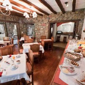 Feast on local flavors during a breakfast buffet from an Argentinian lodge.
