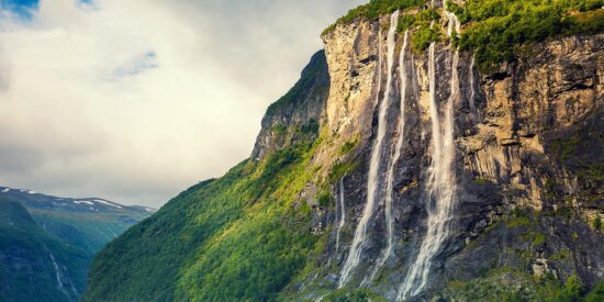 We’ll view the Seven Sisters Waterfall from RIB boats in Norway’s famous Geirangerfjord