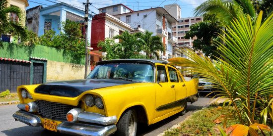 A classic car parked in the Vedado neighborhood of Havana